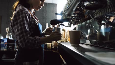 Barista-steaming-milk-for-coffee-drink