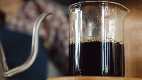 Coffee-dripping-into-a-glass-cup