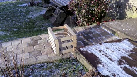 Woman-brings-from-the-basement-outside-the-wooden-boxes