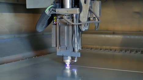 Laser-cut-machine-while-cutting-the-sheet-metal-with-sparks-and-high-precision