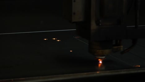 Laser-cut-machine-while-cutting-the-sheet-metal-with-sparks-and-high-precision