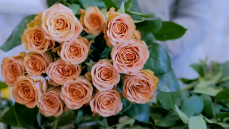 Professional-florist-working-with-flowers-at-studio