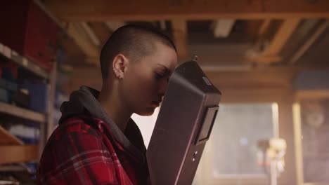 Close-Portrait-of-powerful-female-Welder