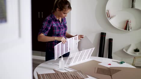 Woman-Working-As-Architect-Building-Housing-Model-Mock-up