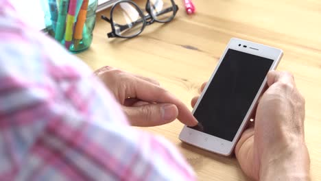 Businessman-in-Pink-Scott-Shirt-Slide-Zoom-Touch-Smartphone-in-Home-Office