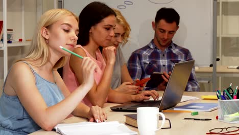 Happy-businesswoman-smiling-to-the-camera-during-meeting