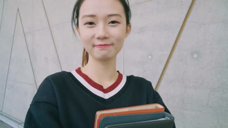 Young-Aspiring-Chinese-Student-with-books