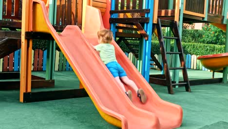 Happy-boy-having-fun-in-kids-amusement-park