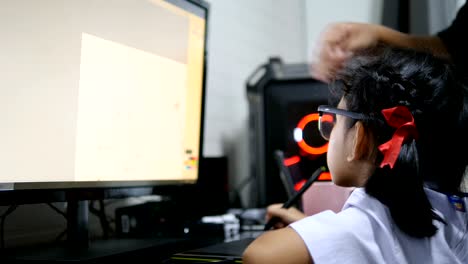 Asian-little-girl-in-Thai-student-uniform-using-pen-tablet-to-drawing-and-digital-painting-with-computer