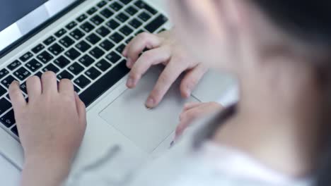 Girl-Using-Laptop-Computer-Touchpad