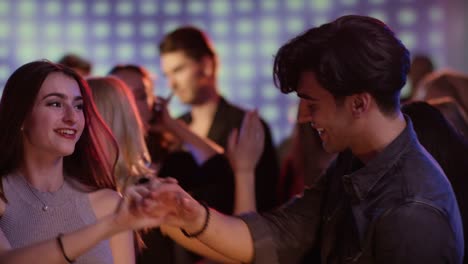 Couple-is-dancing-together-at-club