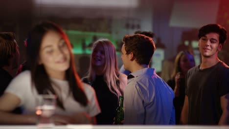 Young-man-checking-out-woman-at-bar