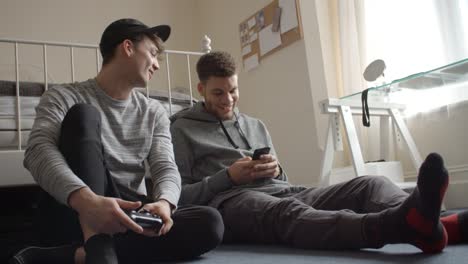 Male-Students-Using-Phone-And-Playing-Video-Game-Shot-On-R3D