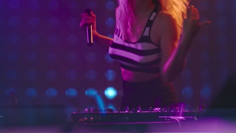 Female-DJ-Playing-Tracks-in-Nightclub