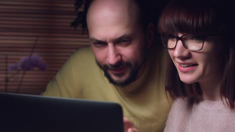 4K-Business-Shot-of-a-Couple-Working-on-Computer-Together-Serious