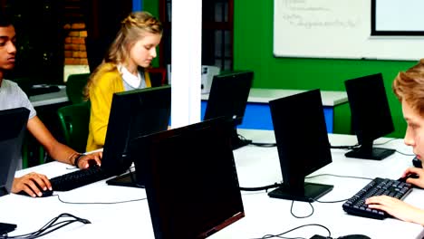 Students-studying-on-computer-in-classroom