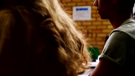 Students-studying-on-computer-in-classroom