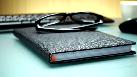 Notebook-and-computer-equipment-on-the-table-in-the-office