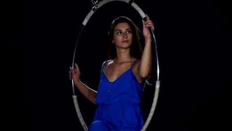 Portrait-of-beautiful-girl-in-blue-dress-in-the-aerial-hoop