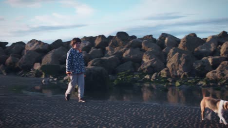 4K-Outdoor-Seaside-Child-and-Dog-Walking-on-Beach