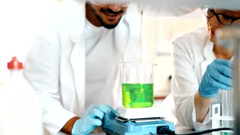 Attractive-student-of-chemistry-working-in-lab