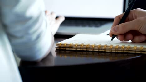 Two-clever-students-study-in-library-desk