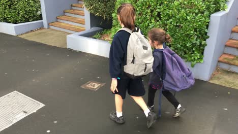 Two-sister-girls-walking-together-to-school