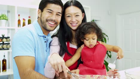 Asian-Chinese-parents-infant-daughter-home-kitchen-baking