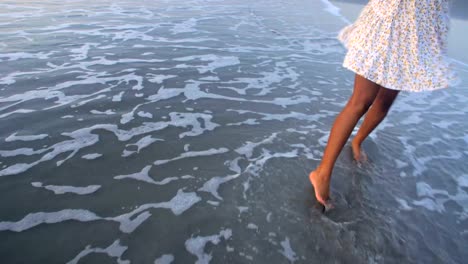 Asian-Indian-female-sunset-dancing-barefoot-on-sand