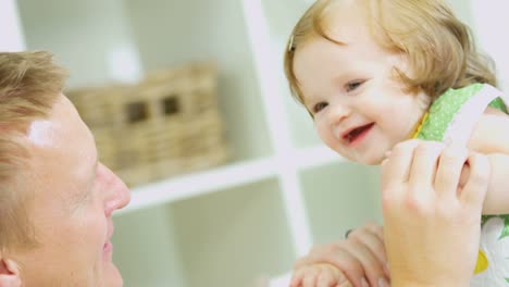 Cute-pre-school-girl-and-father-enjoying-togetherness