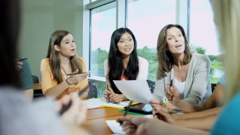 Multi-ethnic-college-students-on-campus-with-teacher