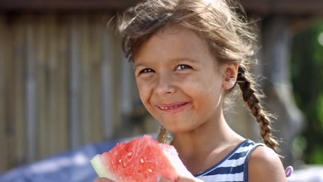 Girl-enjoying-watermelon