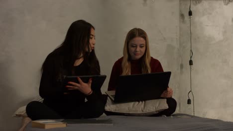 Diverse-girls-studying-with-electronic-devices