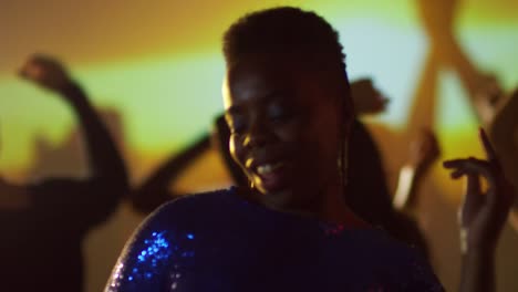 Smiling-Black-Woman-Dancing-at-Party