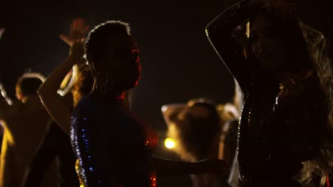 Female-Friends-Enjoying-Music-at-Concert