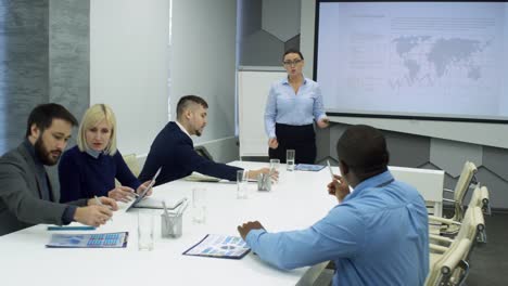 Professional-Female-Coach-Giving-Presentation-to-Business-Group