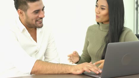 Portraits-of-Employee-talking-about-job-on-laptop-at-office.-Concept-business-sharing-ideas.