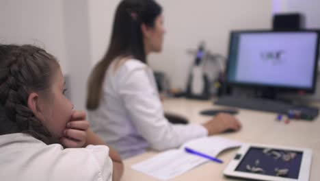 Little-girl-in-the-hospital-office-is-waiting-for-the-test-results