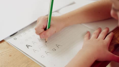 Little-girl-preparing-her-English-homework