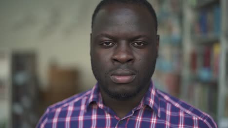 African-american-male-is-thinking-looking-in-camera