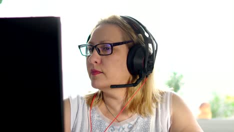 a-woman-50-60-years-old,-at-the-computer