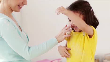 mother-and-daughter-having-fun-at-home-kitchen