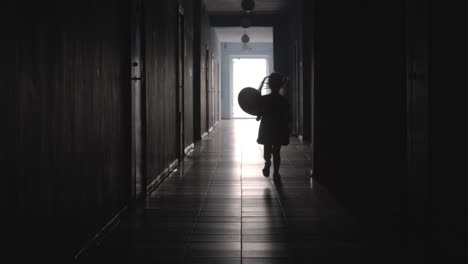 Silhouette-of-Girl-Running-with-Balloon-along-Hallway