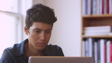 Businesswoman-Using-Laptop-At-Desk-In-Office-Shot-On-R3D