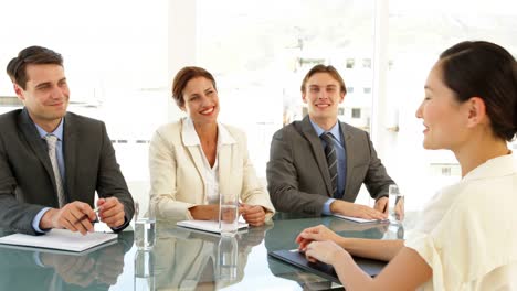 Happy-businesswoman-being-interviewed-and-offered-the-job