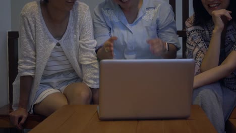 4k-,asian-female-using-a-digital-laptop-computer