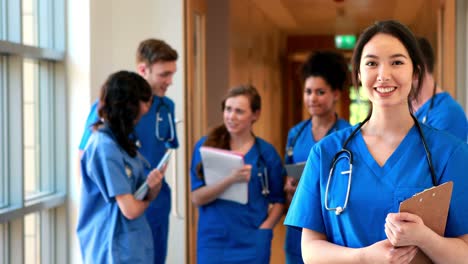 Medical-students-chatting-in-hallway