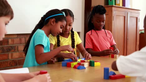 Pupils-playing-with-building-blocks-in-classroom