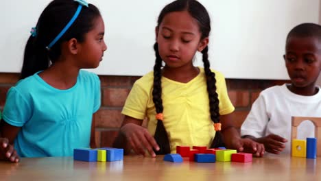 Pupils-playing-with-building-blocks-in-classroom