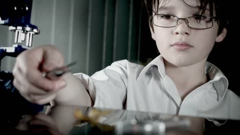 4k-Biology-Student-Child-with-Microscope-Exploring-a-Leaf